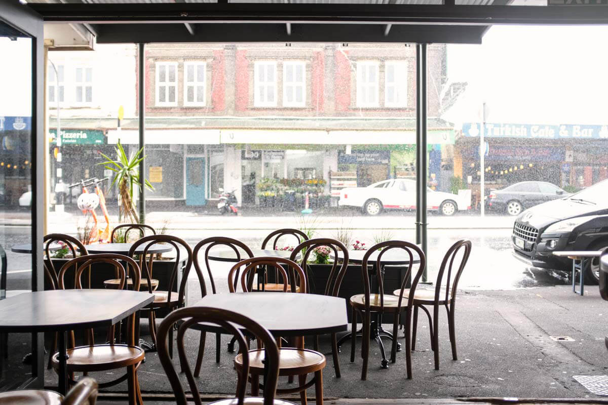 The view from Beau out onto Ponsonby Rd in the rain. Image: Alex Blackwood.